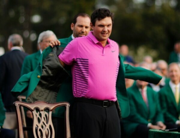 Sergio Garcia puts the Green Jacket on Patrick Reed