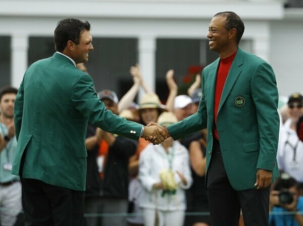 Patrick Reed congratulates Tiger Woods